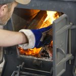 fire wood heating the evaporator in the pineland farms sugar house