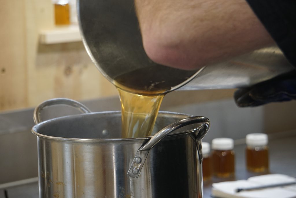 syrup bottling and grading at pineland farms