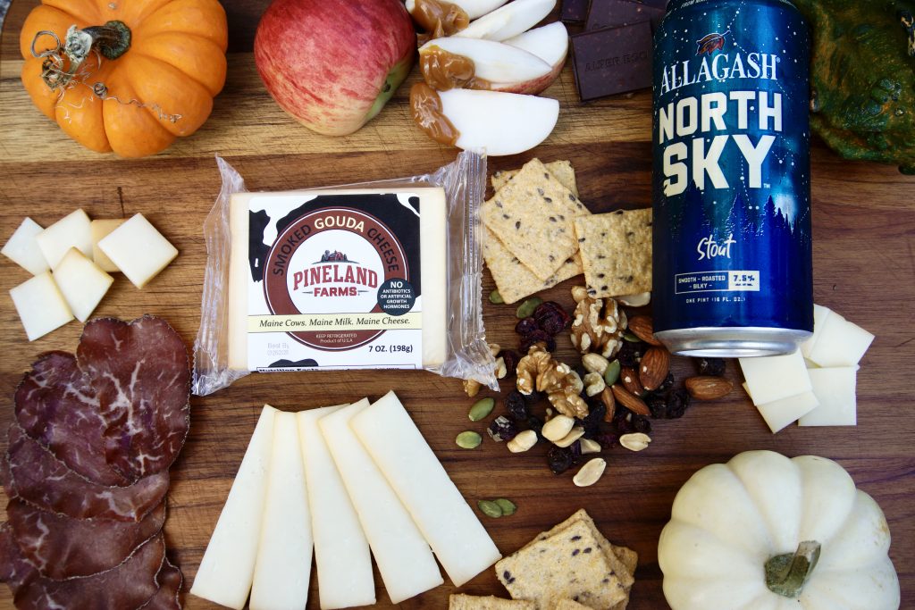 smoked gouda charcuterie board with allagash north sky stout