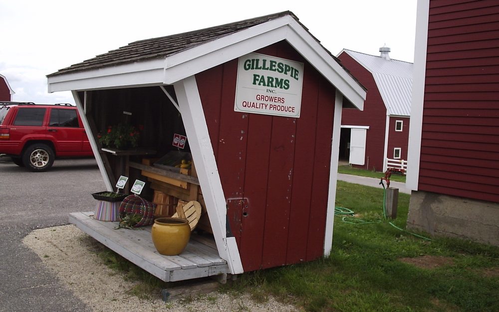 Red and white wooden farm stand at the Produce Division at Pineland Farms